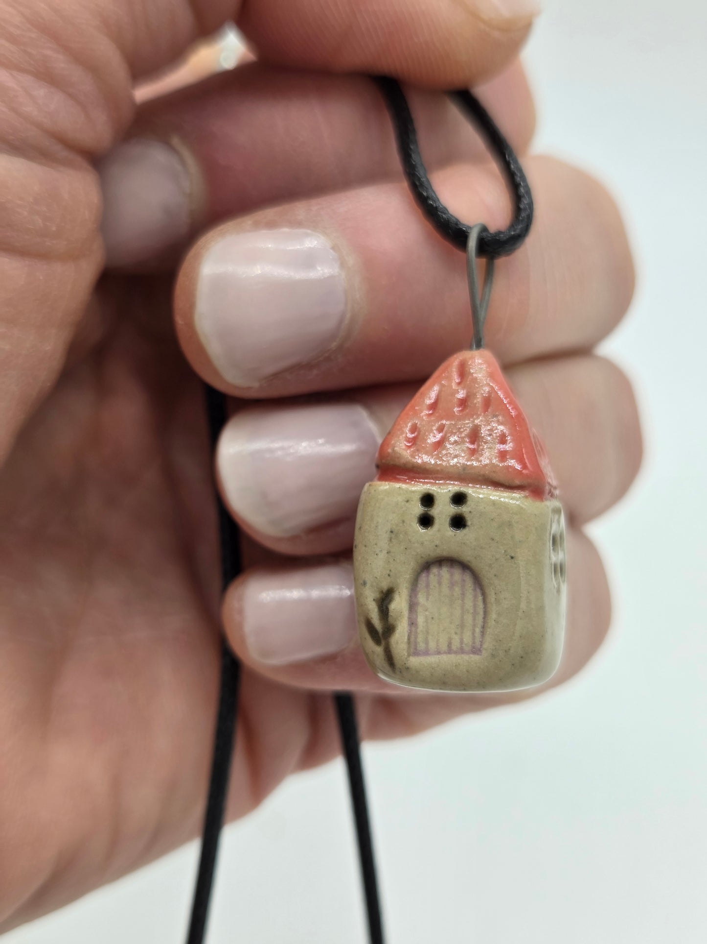 Rose Pink Tiny House Pendant on black waxed cotton necklace
